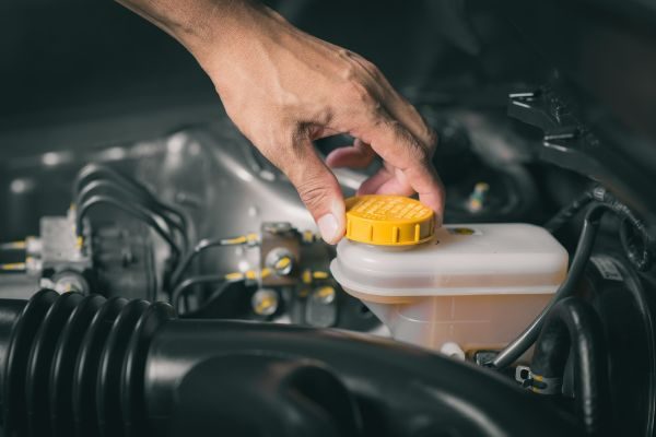 Checking the level of car's brake fluid. Car maintenance.